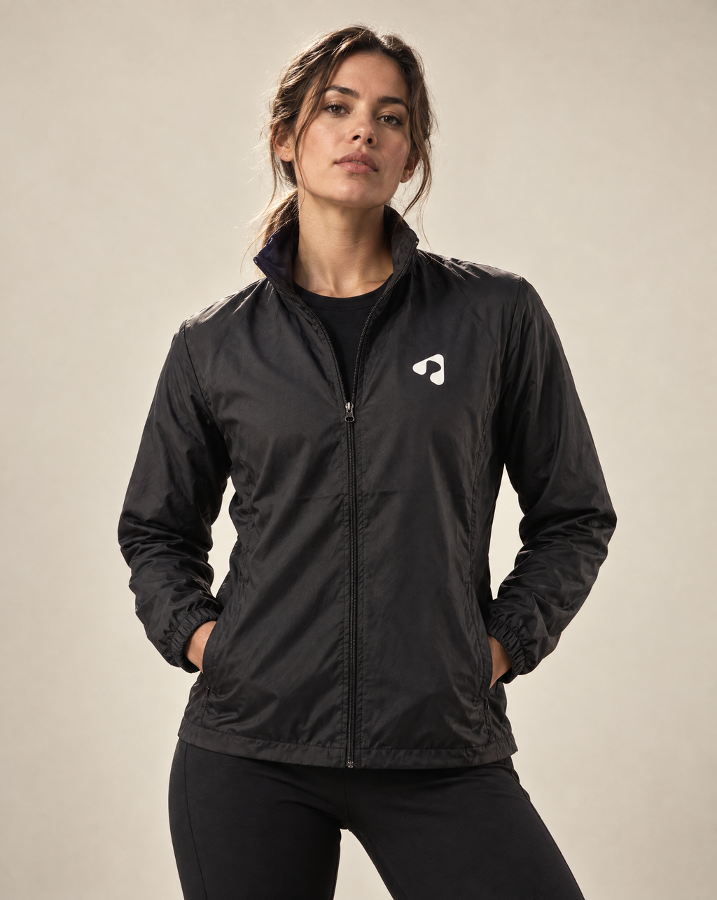 Woman wearing black Boost HYDROX waterproof running jacket front view
