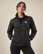 Woman wearing black Boost HYDROX waterproof running jacket front view