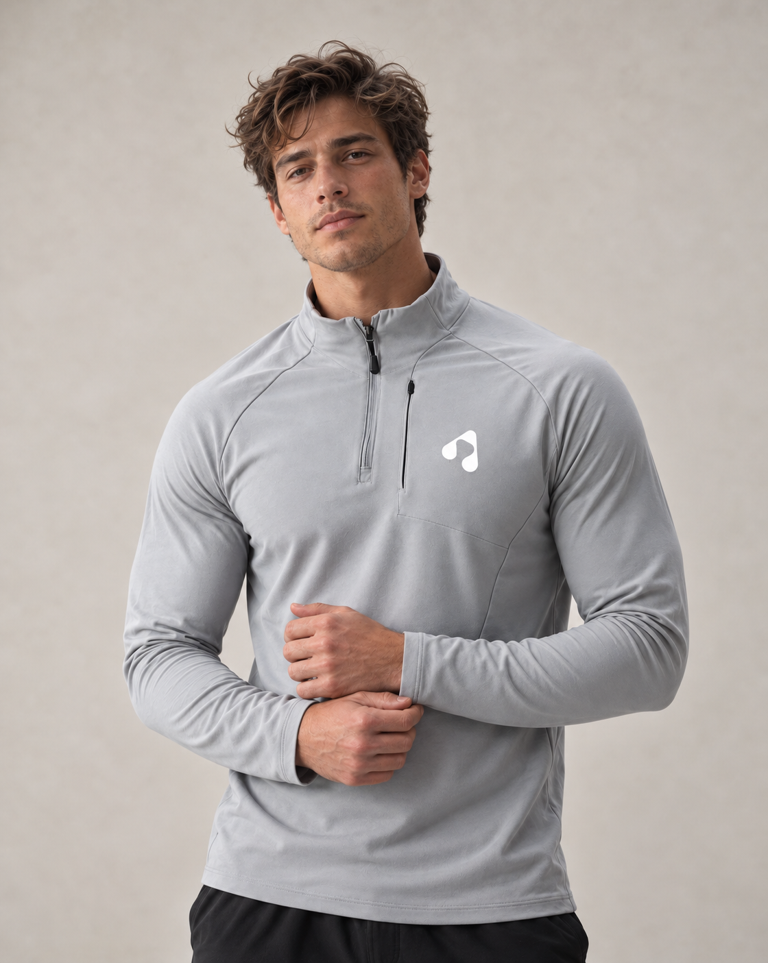 Men wearing light grey Boost quarter zip long sleeve training top