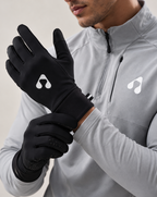 Athlete wearing black Boost Performance Gloves with grey training jacket