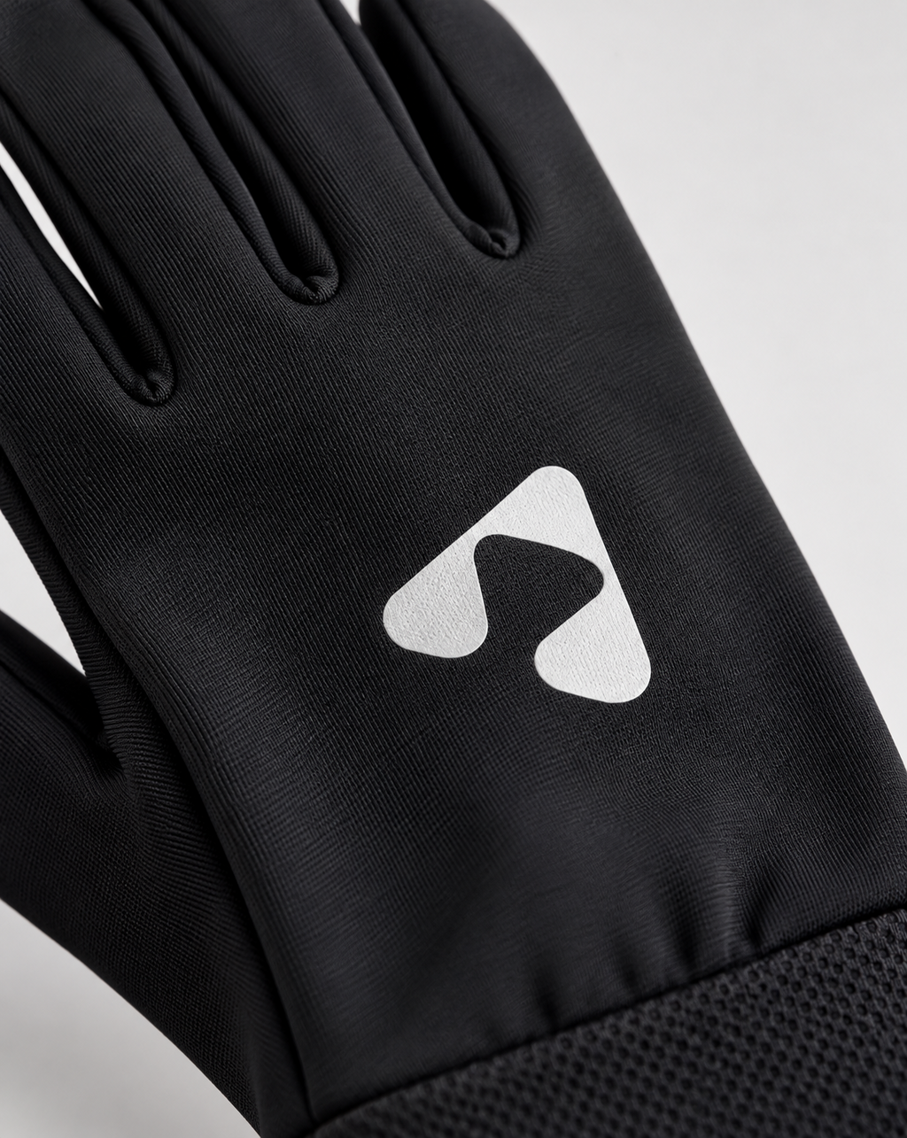 Close-up of white Boost logo on black performance glove